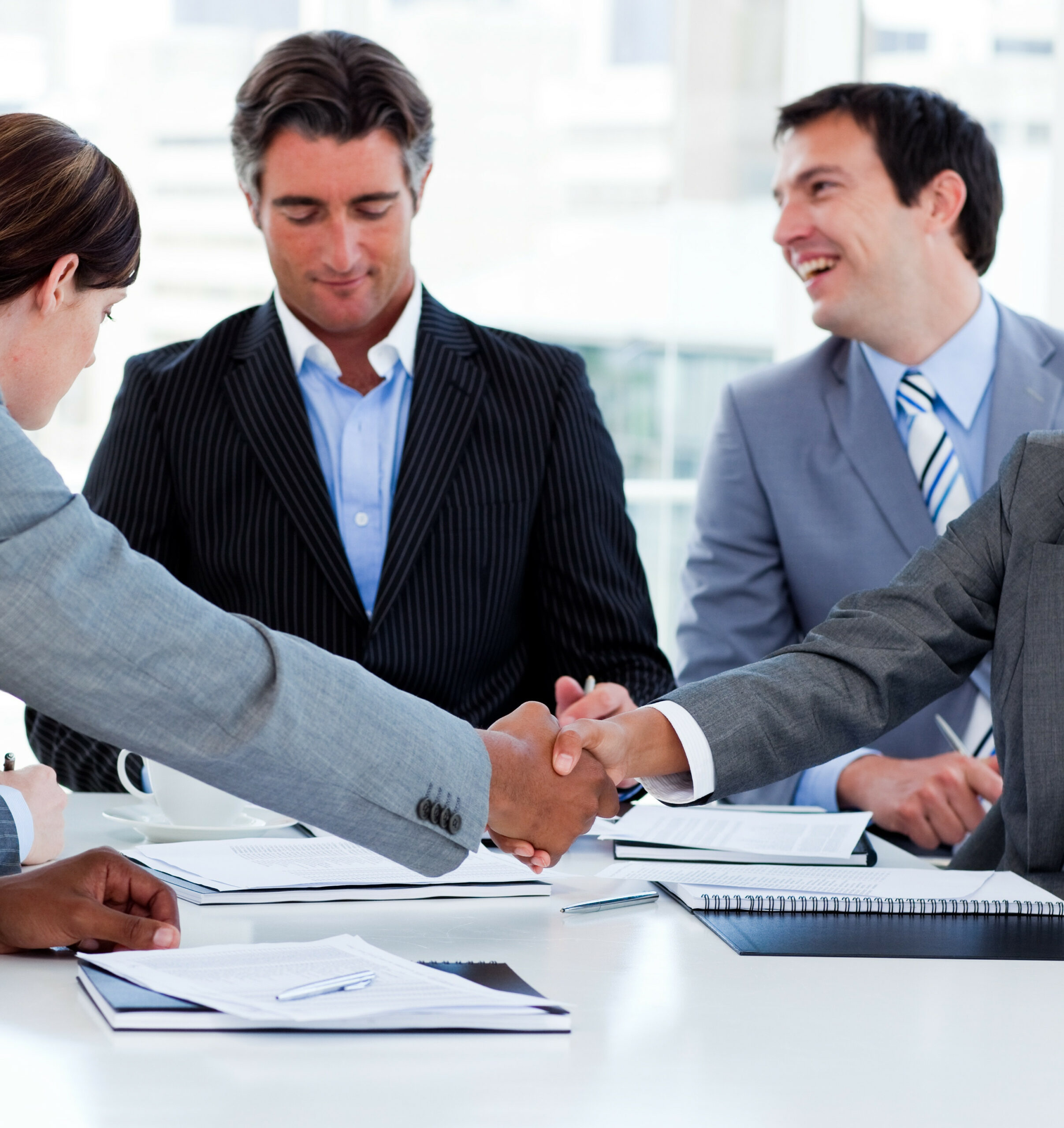 Close-up of successful business people closing a deal Offshore Company Formation for Business Owners